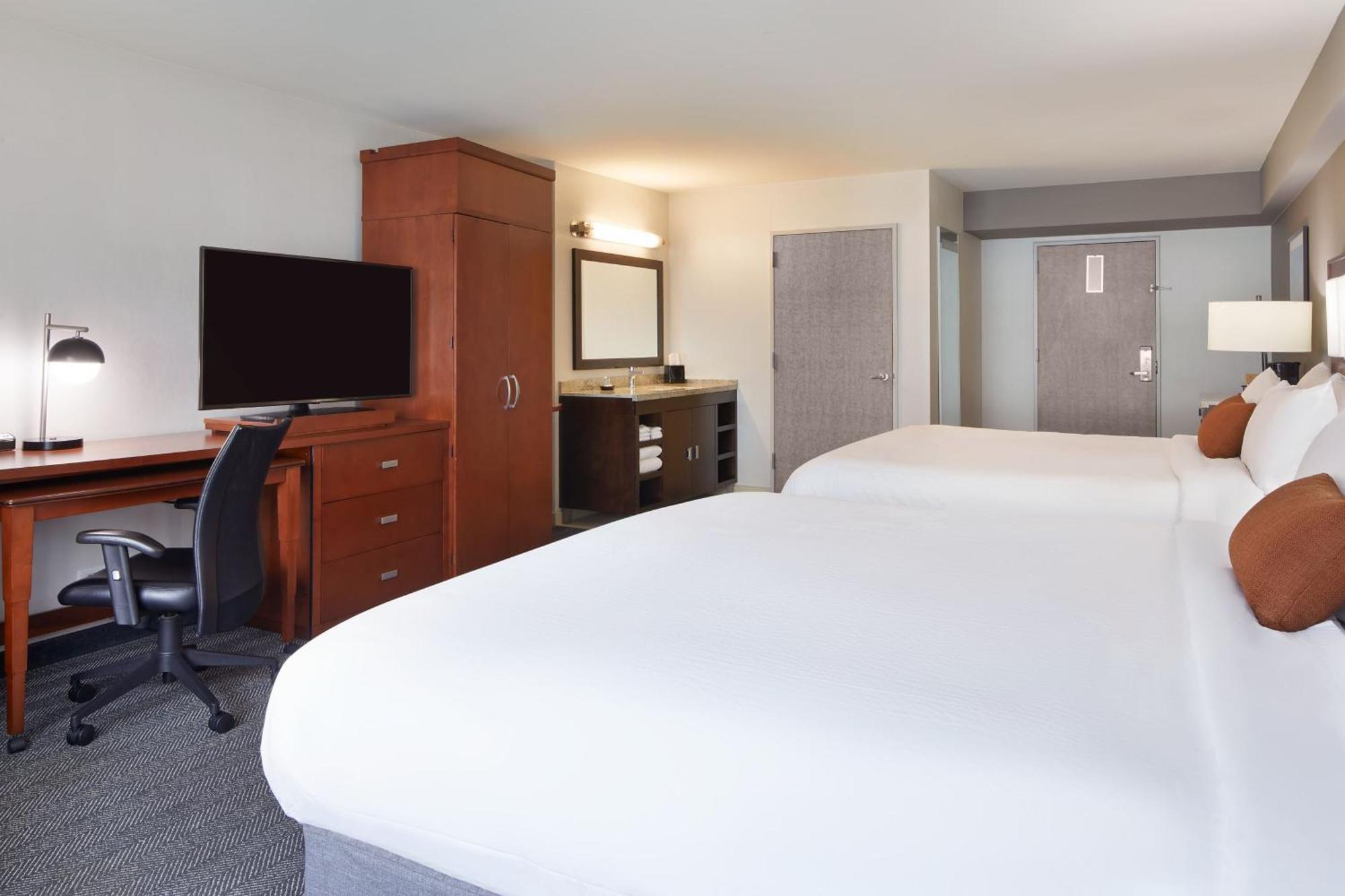 Room Two King Beds Bathtub Mobility Access